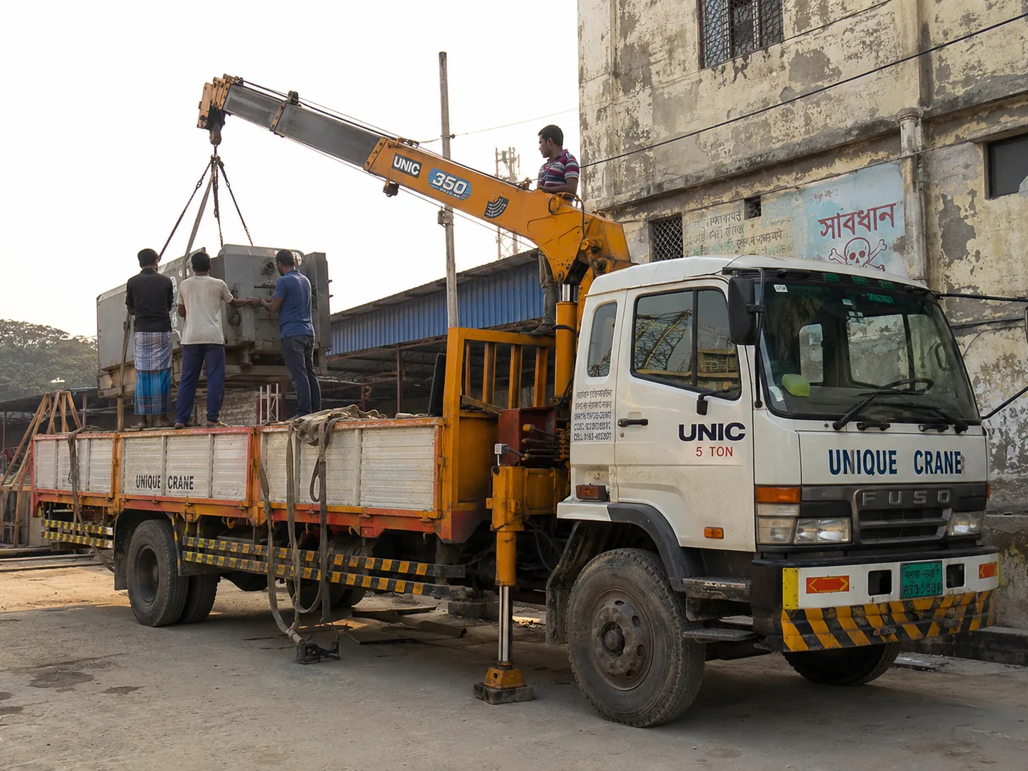 Industrial yard-এ machinery unloading